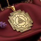 Personalized 14k Gold Ganesh Yantra Necklace, a spiritual amulet for success and new beginnings, is showcased in the primary product photo. The handcrafted Good Luck Charm rests on a luxurious dark red silk background, its sacred geometry shining. This powerful Remover of Obstacles talisman is a perfect gift for graduation or a new job, also available in 925 sterling silver and rose gold plated options.