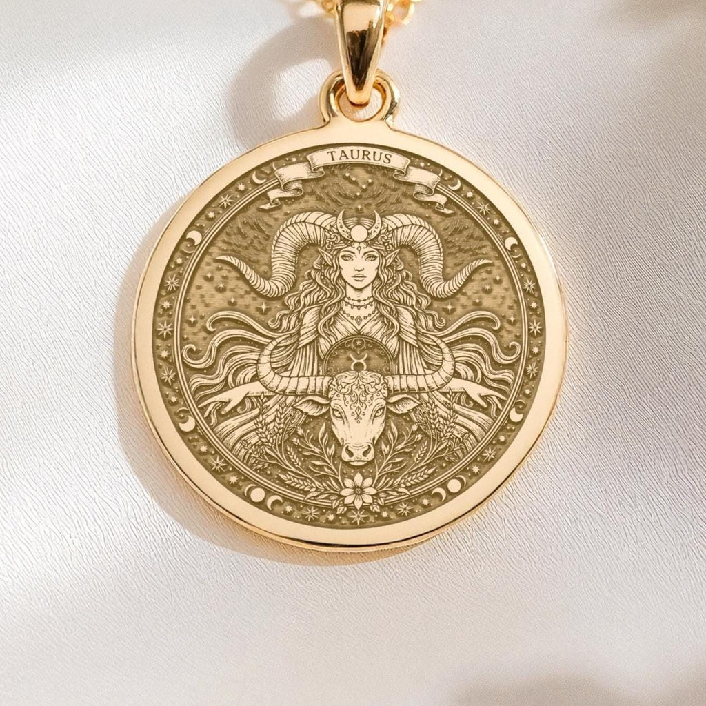 14K solid gold Taurus medallion. The art shows the bull-horned goddess, symbolizing stability, a precious April birthday gift.