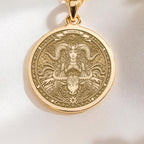 14K solid gold Taurus medallion. The art shows the bull-horned goddess, symbolizing stability, a precious April birthday gift.