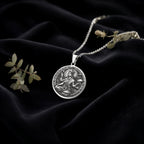 Devi Annapurna Goddess Pendant Necklace Necklaces 925 925 Sterling Silver round pendant featuring a classical mythological figure on black fabric.