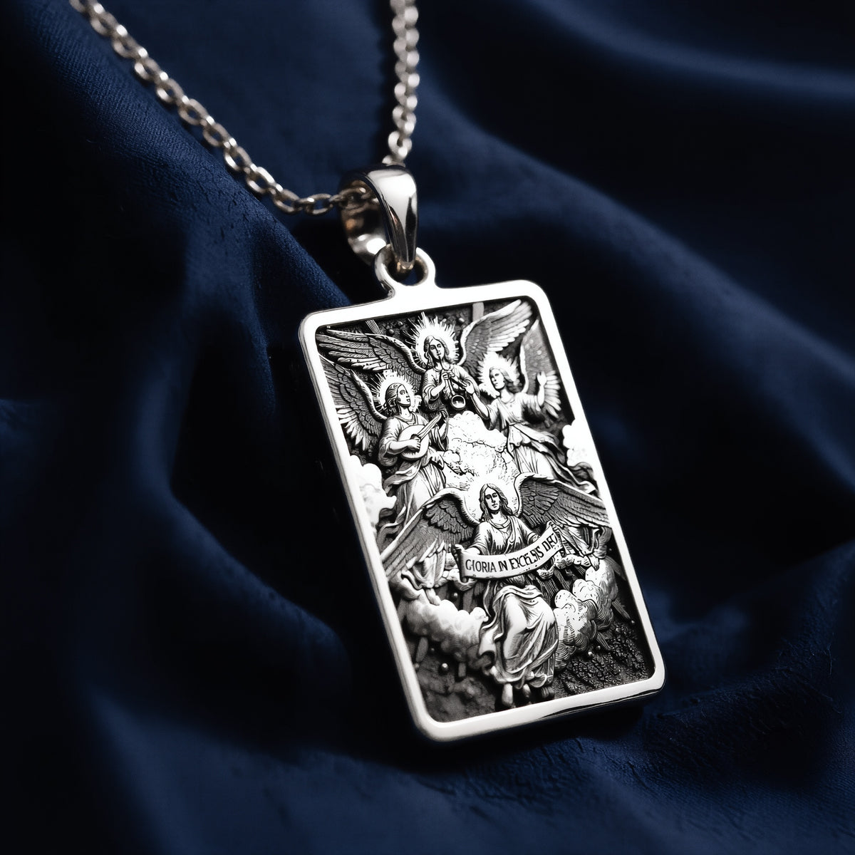 Silver necklace with a pendant featuring a design of angels in flight, polished surface finish, viewed from the front.