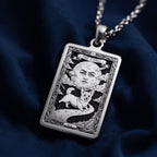 A handmade 14K gold plated Corgi necklace. The engraving captures the celestial dog in a whimsical tarot card style.