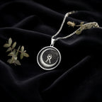 Crescent Moon Celestial Pendant Necklaces 925 925 Sterling Silver round pendant necklace with intricate circular design on black velvet background