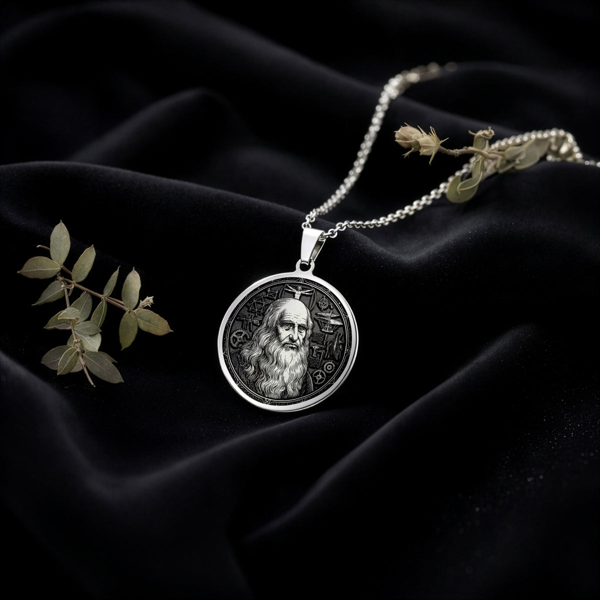 Da Vinci Renaissance Art Pendant Necklaces 925 925 Sterling Silver portrait pendant necklace with bearded man design on dark fabric.