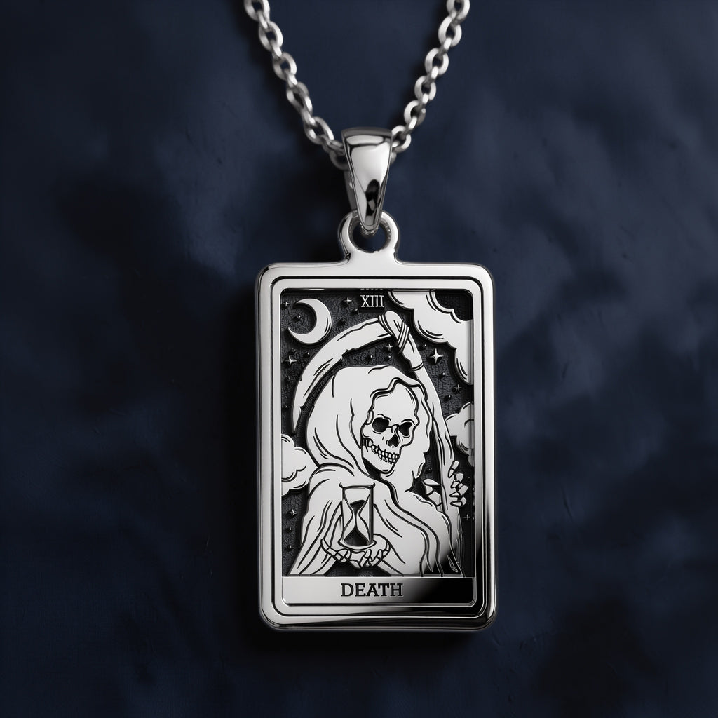 Sterling silver rectangular pendant necklace featuring an engraved Rider-Waite Death tarot card design with a hooded skeletal figure, hourglass, crescent moon, stars, Roman numeral XIII, and "DEATH" inscription at the bottom.
