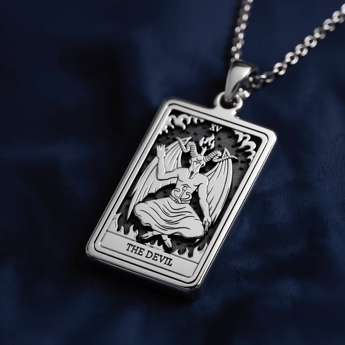 Rectangular 925 sterling silver pendant necklace featuring a raised, engraved depiction of The Devil tarot card (XV) with wings, horns, and flames, suspended from a polished cable chain.