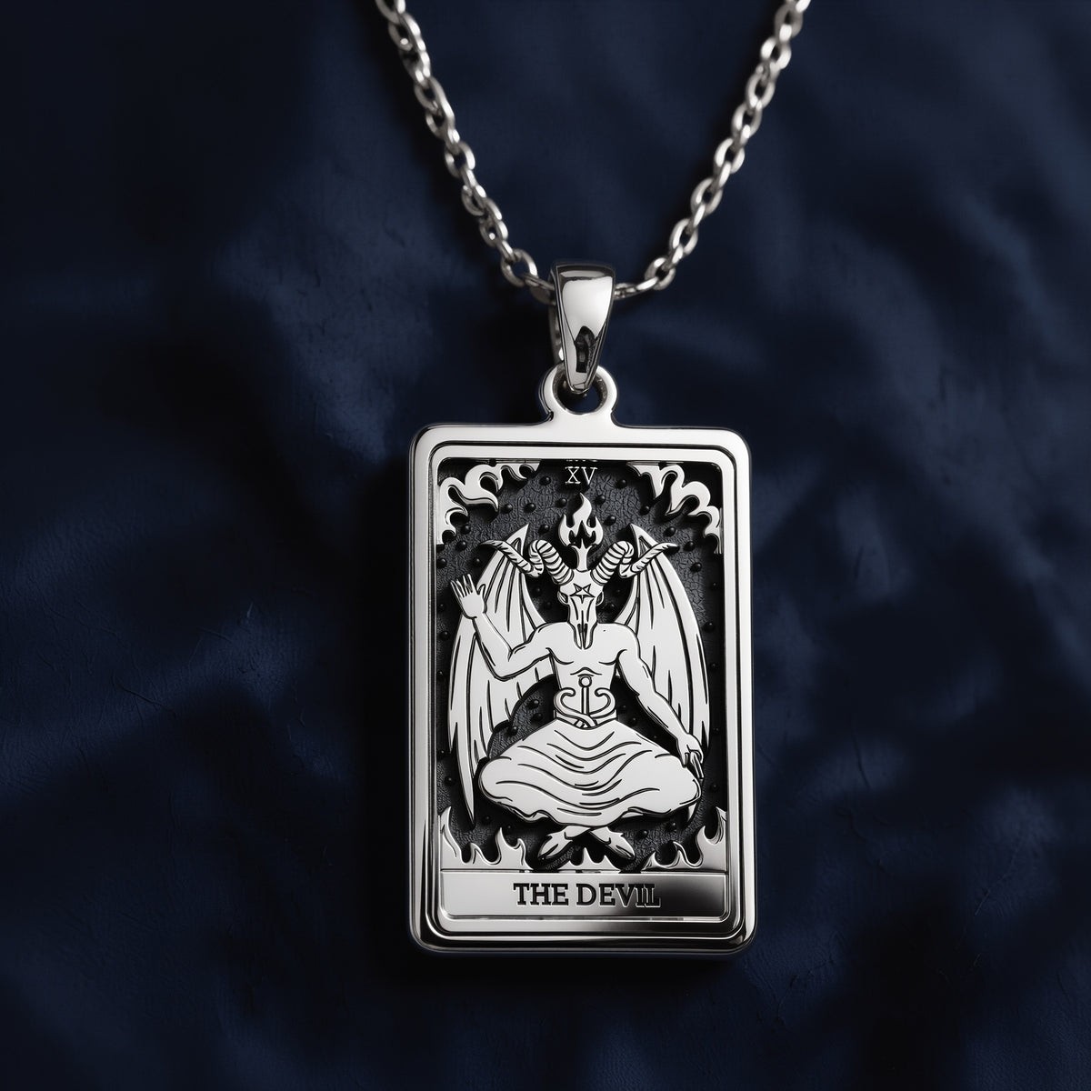 Detailed engraved rectangular pendant necklace featuring The Devil tarot card (XV) with horned winged figure, flames, and "THE DEVIL" inscription, crafted in polished 925 sterling silver on a matching cable chain.