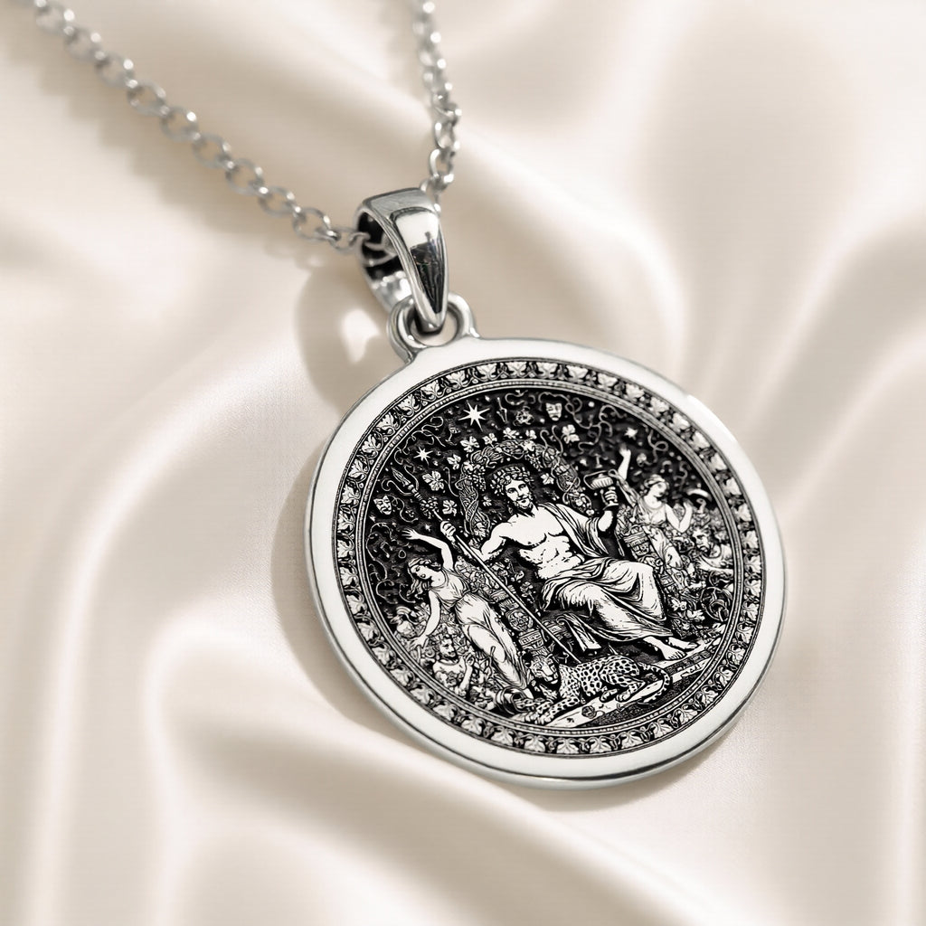 Silver circular pendant featuring a detailed classical scene with figures, presented in a silver tone. The pendant hangs from a silver chain and is viewed from the front.