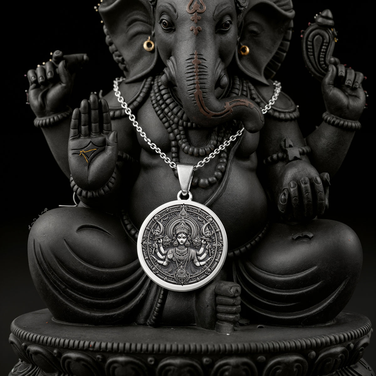 Durga Warrior Goddess Pendant Necklaces 925 925 Sterling Silver necklace with a round Ganesha pendant on a black background