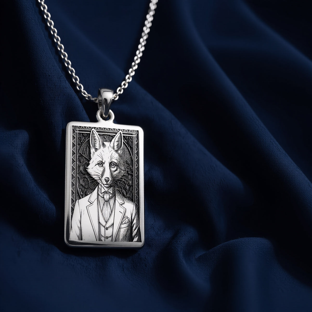 A handcrafted 925 sterling silver sly fox charm in a rectangular shape. This personalized piece of anthropomorphic jewelry is a standout accessory for an admirer of the trickster archetype.