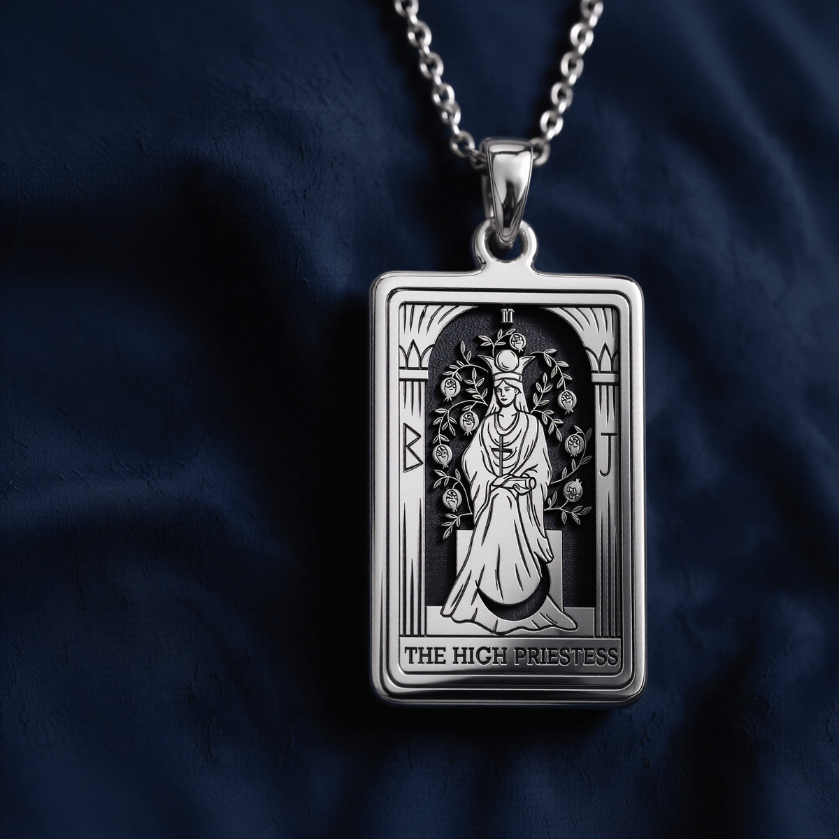 Rectangular High Priestess Tarot pendant necklace in polished 925 sterling silver, featuring an engraved seated figure with moon crown, pomegranate vines, fluted pillars, Roman numeral II, and “THE HIGH PRIESTESS” inscription at the bottom.