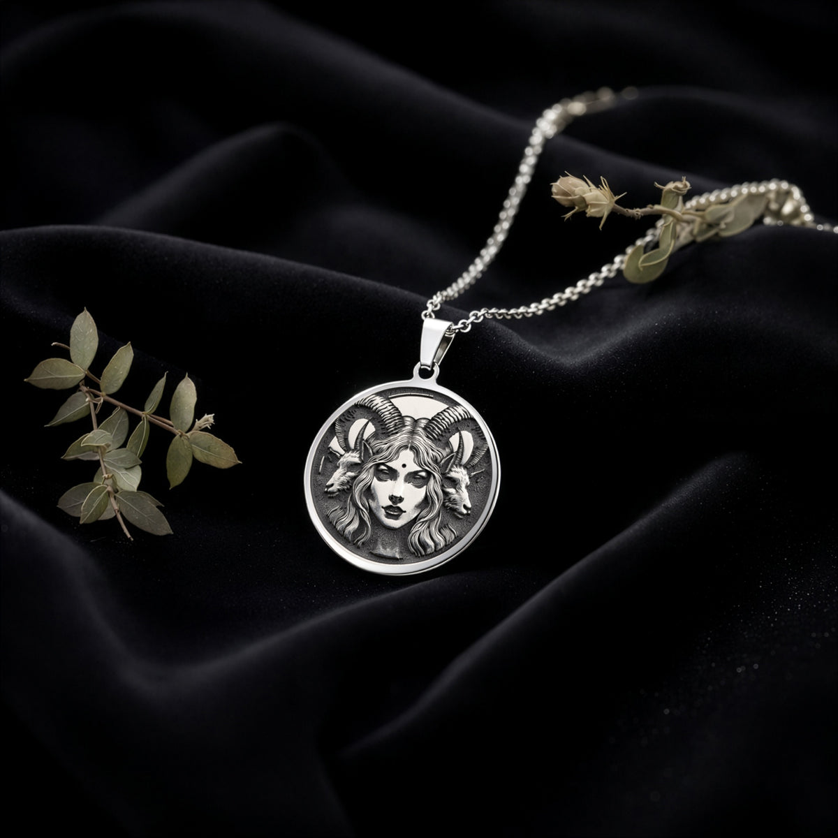 925 925 Sterling Silver Lilith Goddess Necklace Necklaces Silver-toned pendant necklace featuring a detailed face with horns on black fabric.