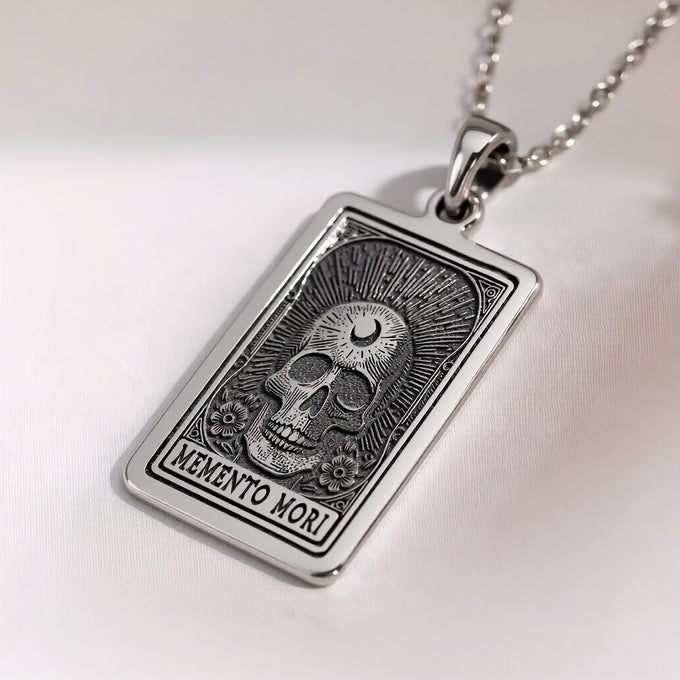 Gothic Memento Mori skull necklace pendant. Silver or gold plated amulet with sunburst design. Unique gothic jewelry style.