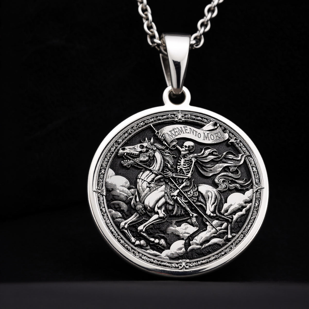 Skeleton Horseman Memento Mori Pendant in sterling silver, front view showing engraved skeleton rider on horse with banner.