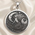 Silver Ocean Siren Mermaid Necklace: round of mermaid sea creature with engra
