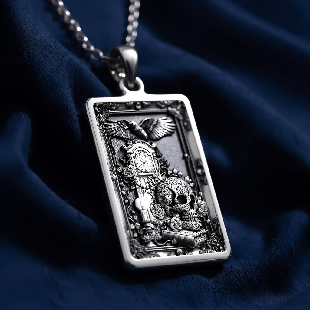 Silver skull tarot pendant with gothic style design, shown from a slight angle. The pendant has a detailed, intricate carving and a matte finish. It is presented on a plain background.