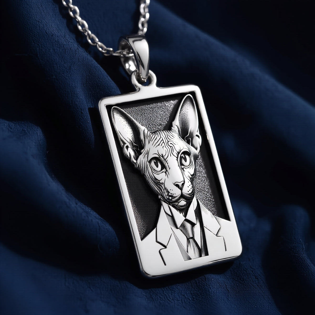 Macro detail view of 925 Sterling Silver Dapper Sphynx Cat Man Portrait Rectangle Pendant Necklace, highlighting polished bail and three-dimensional relief.