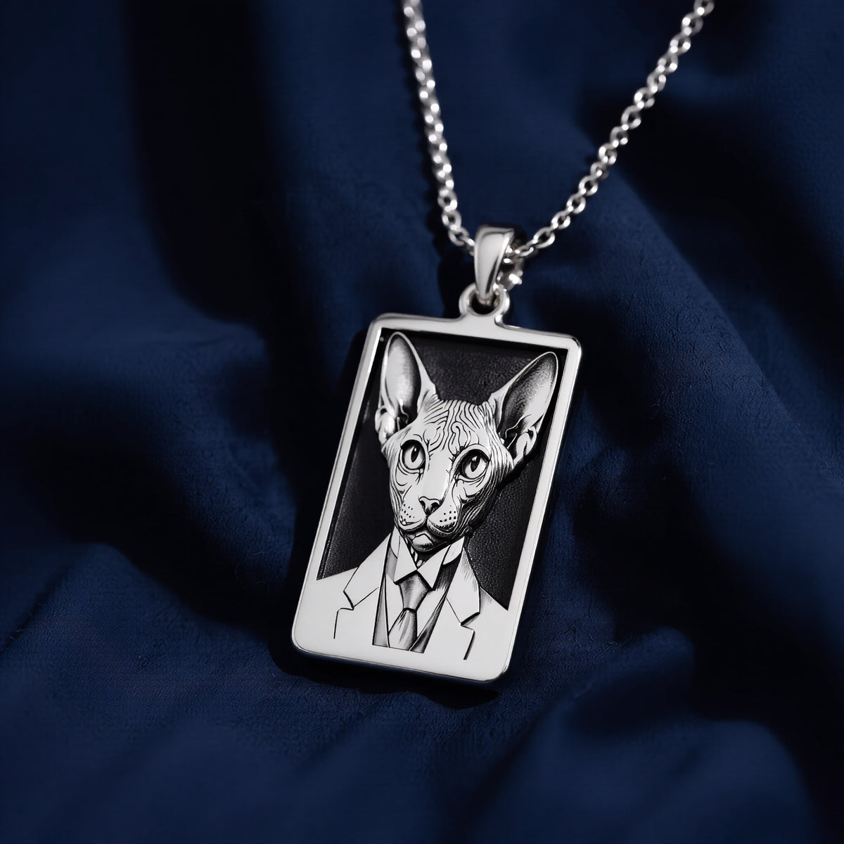 Atmospheric studio close-up of 925 Sterling Silver Dapper Sphynx Cat Man Portrait Rectangle Pendant Necklace, highlighting vintage aesthetic in solid hypoallergenic 925 sterling silver.