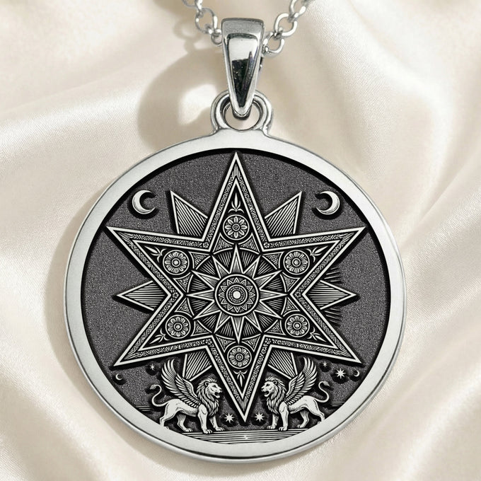 Silver pendant featuring an intricate star design with geometric patterns and stylized figures at the bottom. The pendant is attached to a chain and rests on draped fabric and a dark surface.