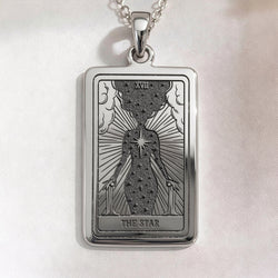 Star Tarot Necklace pendant in sterling silver. Rectangular XVII card shows robed figure, radiant lines and engraved text.