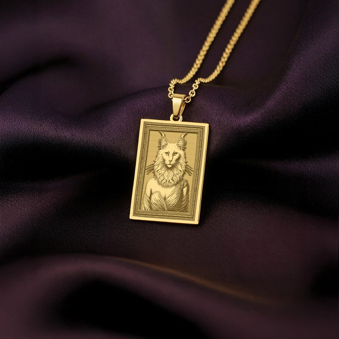 A handmade 14K gold plated rectangular necklace with a highly detailed engraving of a Turkish Angora cat woman. The anthropomorphic art shows the divine feline in elegant, regal attire.