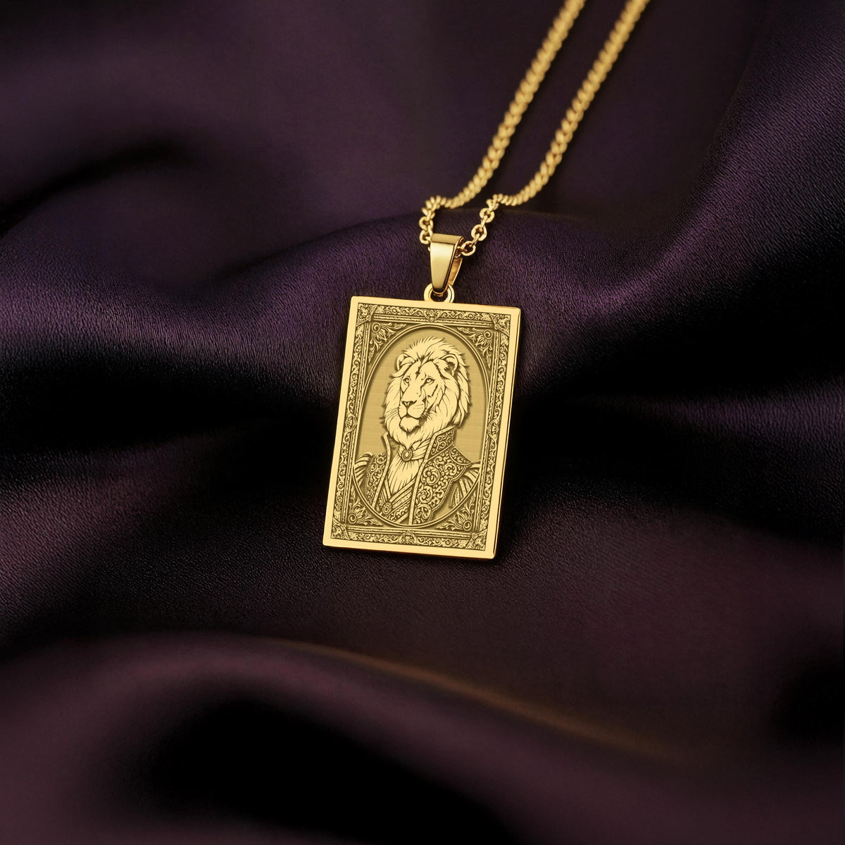 A handmade 14K gold plated rectangular necklace with a highly detailed engraving of a regal lion man. The anthropomorphic art shows a fable character, the King of Beasts, in ornate attire.