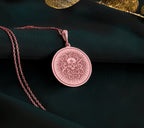 a necklace with a medallion on a chain