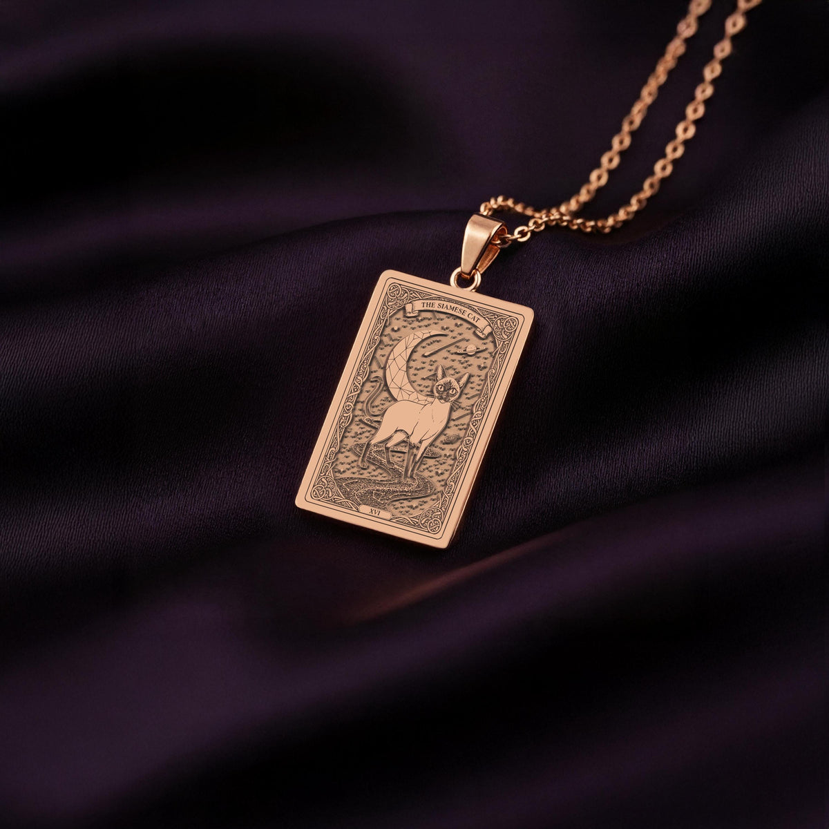 A custom rose gold plated Cat Lover tarot necklace. This piece is a perfect gift, honoring the intelligent and vocal Siamese cat.