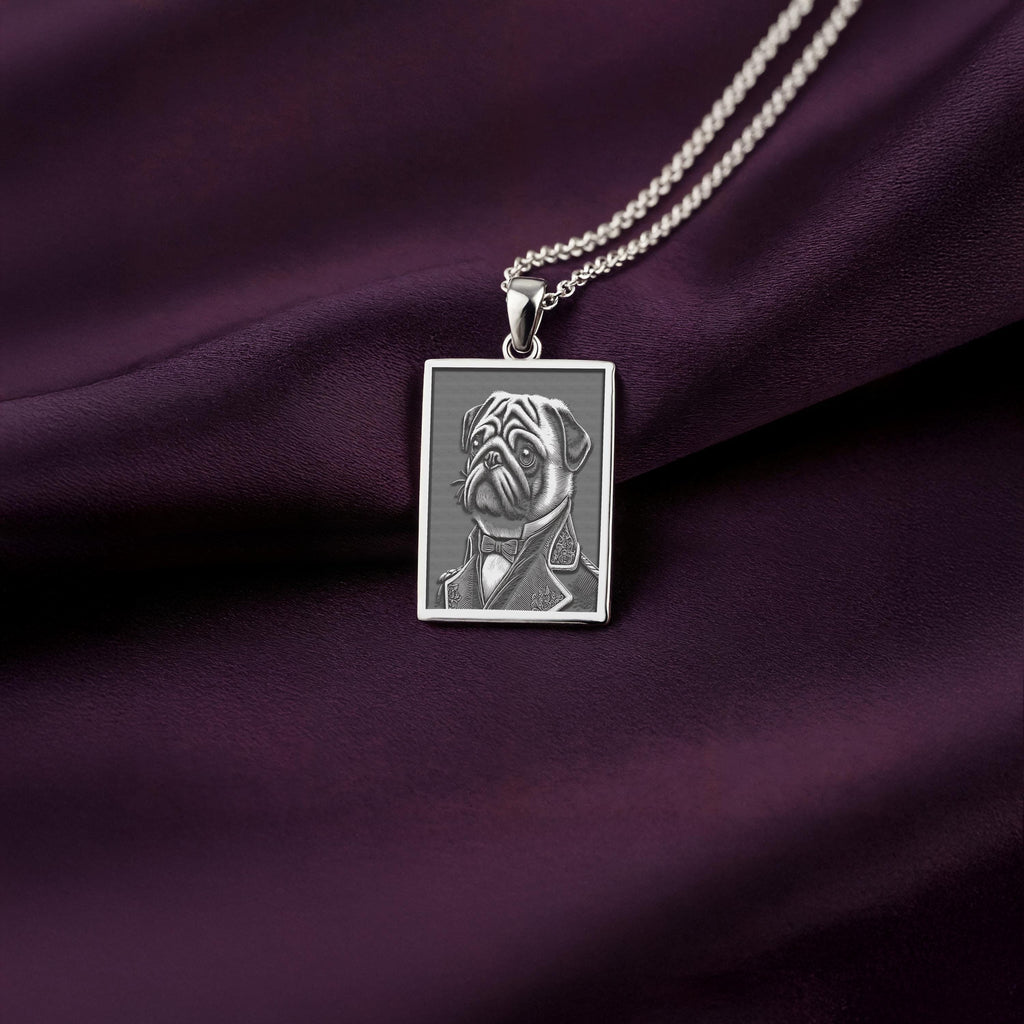 Sharp, detailed laser engraving of a grumpy-yet-dapper Pug on a minimalist 925 sterling silver tag necklace, a perfect gothic accessory for men.