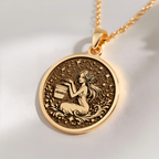 Aquarius Water Bearer Necklace Pendants 14K 14K Gold Plated pendant with a seated goddess design surrounded by vines and stars necklace