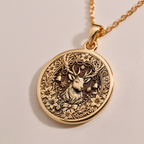 Christmas Deer Necklace Charm Necklaces 14K 14K Gold Plated pendant necklace featuring a detailed deer head surrounded by a floral wreath.