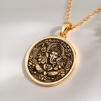 Ganesha Elephant God Pendant Necklaces 14K 14K Gold Plated pendant necklace featuring an ornate Ganesha design on a round disc.