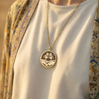 Gemini Zodiac Astrological Sign Necklace Necklaces 14K 14K Gold Plated pendant necklace featuring two intertwined female figures in a circular design.