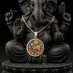 Kamadhenu Cow Hindu Cow Pendant Necklaces 14K 14K Gold Plated round pendant with lion motif necklace on a statue background