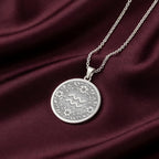 925 Sterling Silver Aquarius Zodiac Medallion showcasing water bearer symbol surrounded by intricate floral botanical patterns and ornate decorative elements. Detailed astrology coin pendant. Premium Aquarius jewelry symbolizing cosmic wisdom and celestial strength.