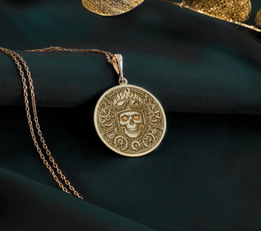 14K Gold Plated Biker Skull Medallion with steampunk elements. Detailed aviator skull pendant with helmet, goggles and mechanical gear background. Bold statement jewelry gift representing fearless riding spirit and industrial aesthetics.