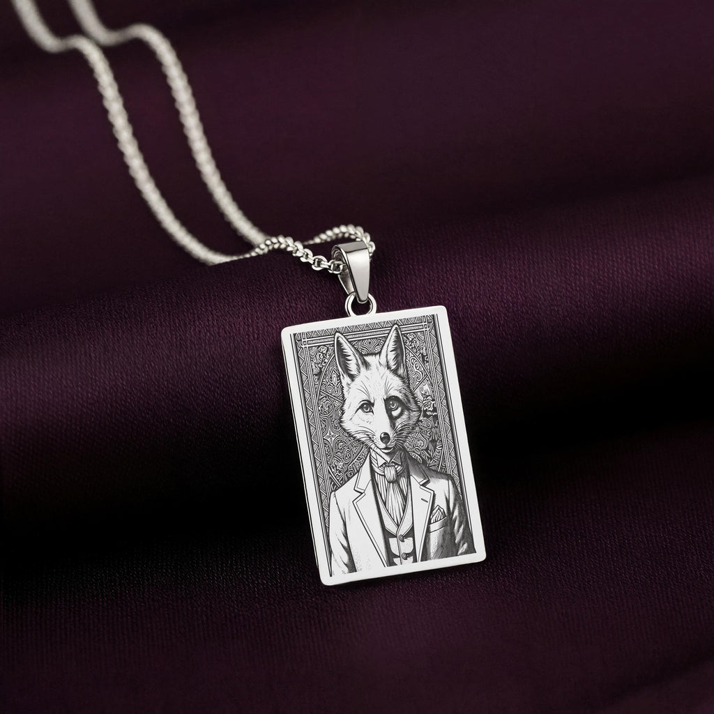 A handcrafted 925 sterling silver sly fox charm in a rectangular shape. This personalized piece of anthropomorphic jewelry is a standout accessory for an admirer of the trickster archetype.
