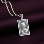 Another perspective of the 925 Sterling Silver Scottish Fold necklace, with the lighting emphasizing the texture of the engraved waistcoat and collar.