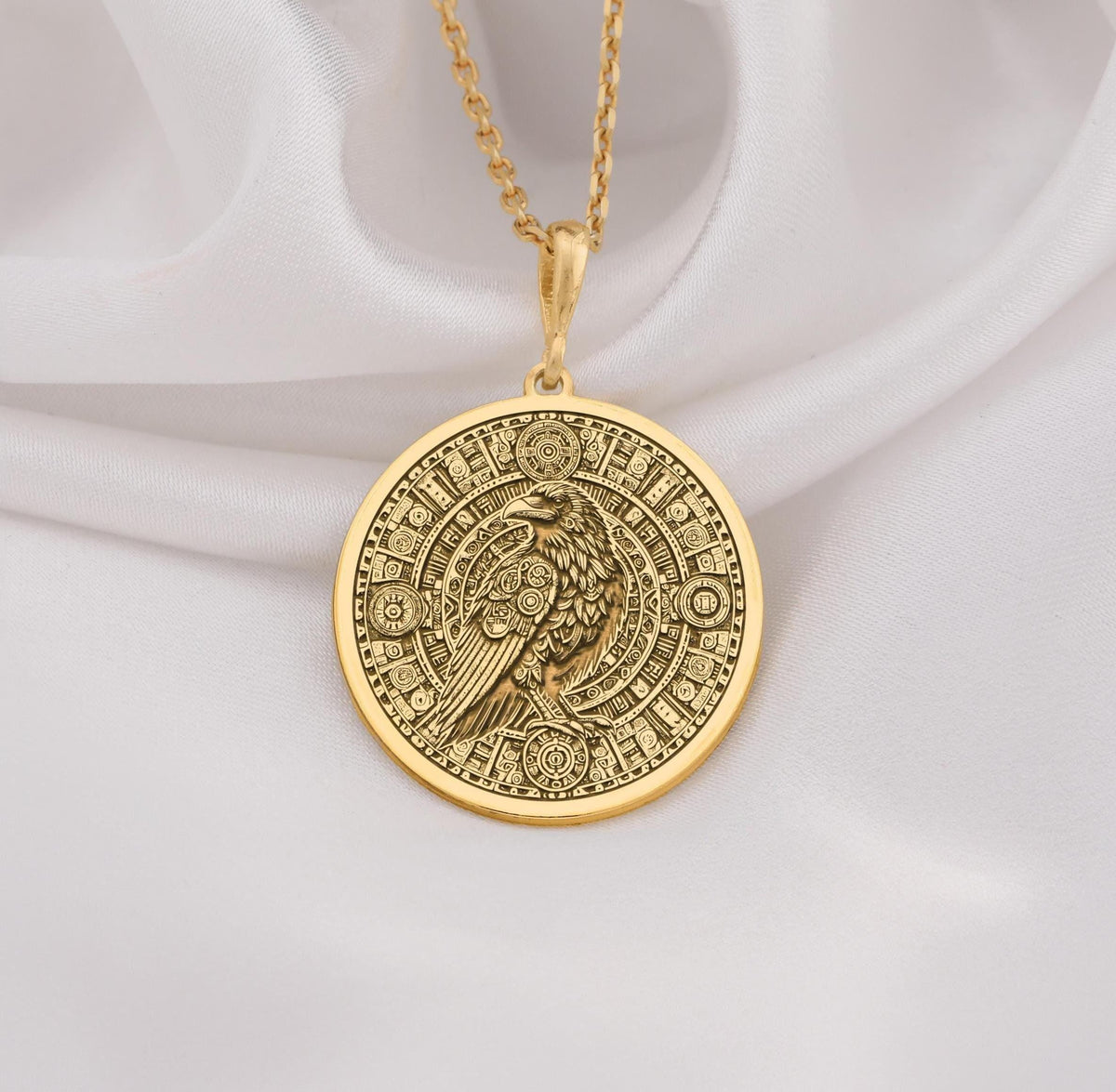14K Gold Raven Pendant Necklace with intricate Aztec calendar design, perfect for mythology lovers. Ideal gift for anniversaries, birthdays, or special occasions. A timeless gold piece blending cultural symbolism and style.