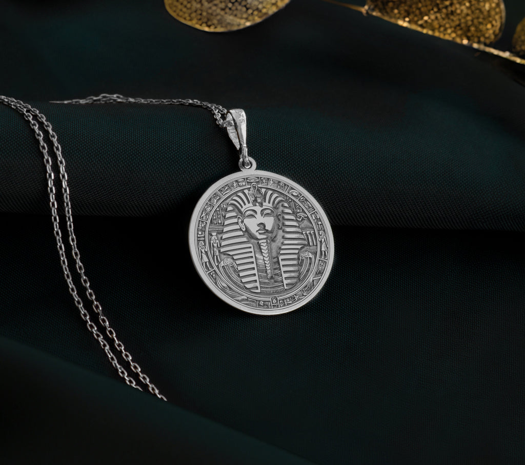 925 sterling silver Tutankhamun coin pendant, inspired by ancient Egyptian royalty. Lightweight and ideal for layering, this dainty amulet is a unique gift for lovers of history and elegance, blending minimalist design with resilience.