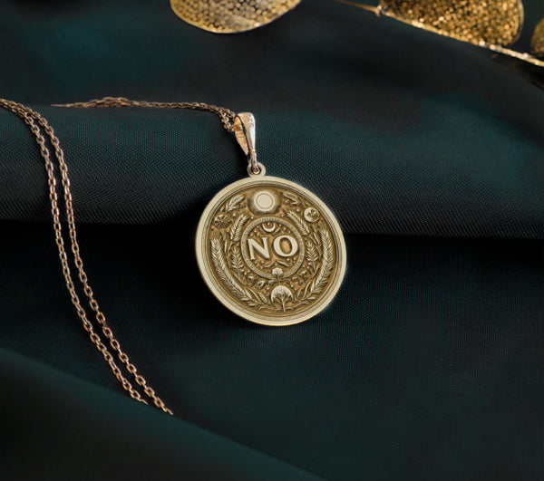 14K Gold Plated NO Medallion with protective symbolism. Detailed boundary affirmation pendant with evil eye, moon motif and botanical laurel wreath. Elegant self-respect jewelry gift representing personal sovereignty and conscious decision-making.