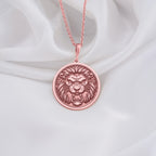 a necklace with a lion head on it