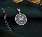 925 Sterling Silver NO Pendant with detailed boundary design. Handcrafted silver coin charm featuring empowering affirmation surrounded by protective evil eye, moon and laurel elements. Self-respect jewelry celebrating personal sovereignty.