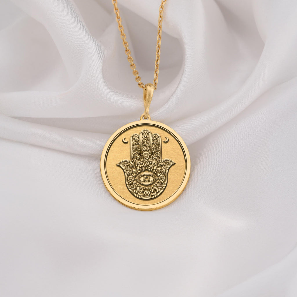 Hamsa pendant in 14K Solid Gold featuring the Evil Eye symbol, representing spiritual protection and good fortune. Ideal gold necklace for gifting or everyday wear with a bohemian touch.