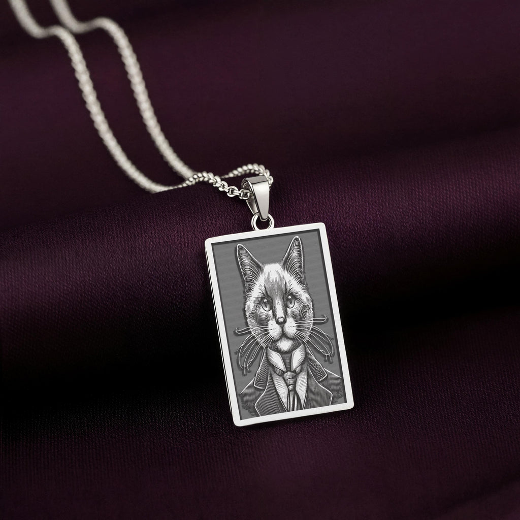Sharp, detailed laser engraving of a Siamese cat on a minimalist 925 sterling silver tag necklace, a perfect gothic accessory for men.