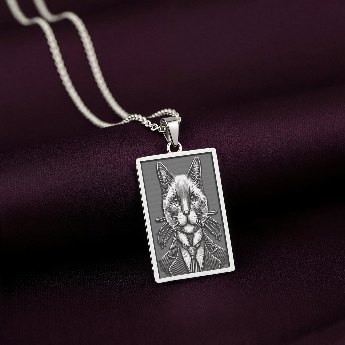 Sharp, detailed laser engraving of a Siamese cat on a minimalist 925 sterling silver tag necklace, a perfect gothic accessory for men.