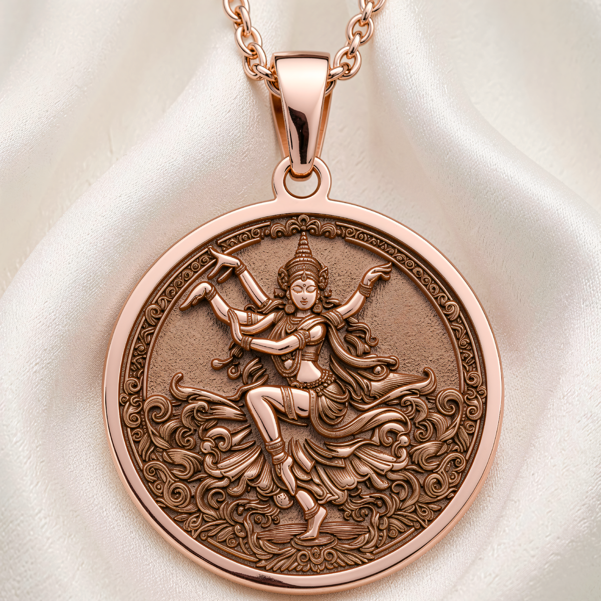 Front view of Apsara Dancer Celestial Pendant in 14K Rose Gold Plated, featuring an engraved multi-armed dancer surrounded by ornate scrollwork.