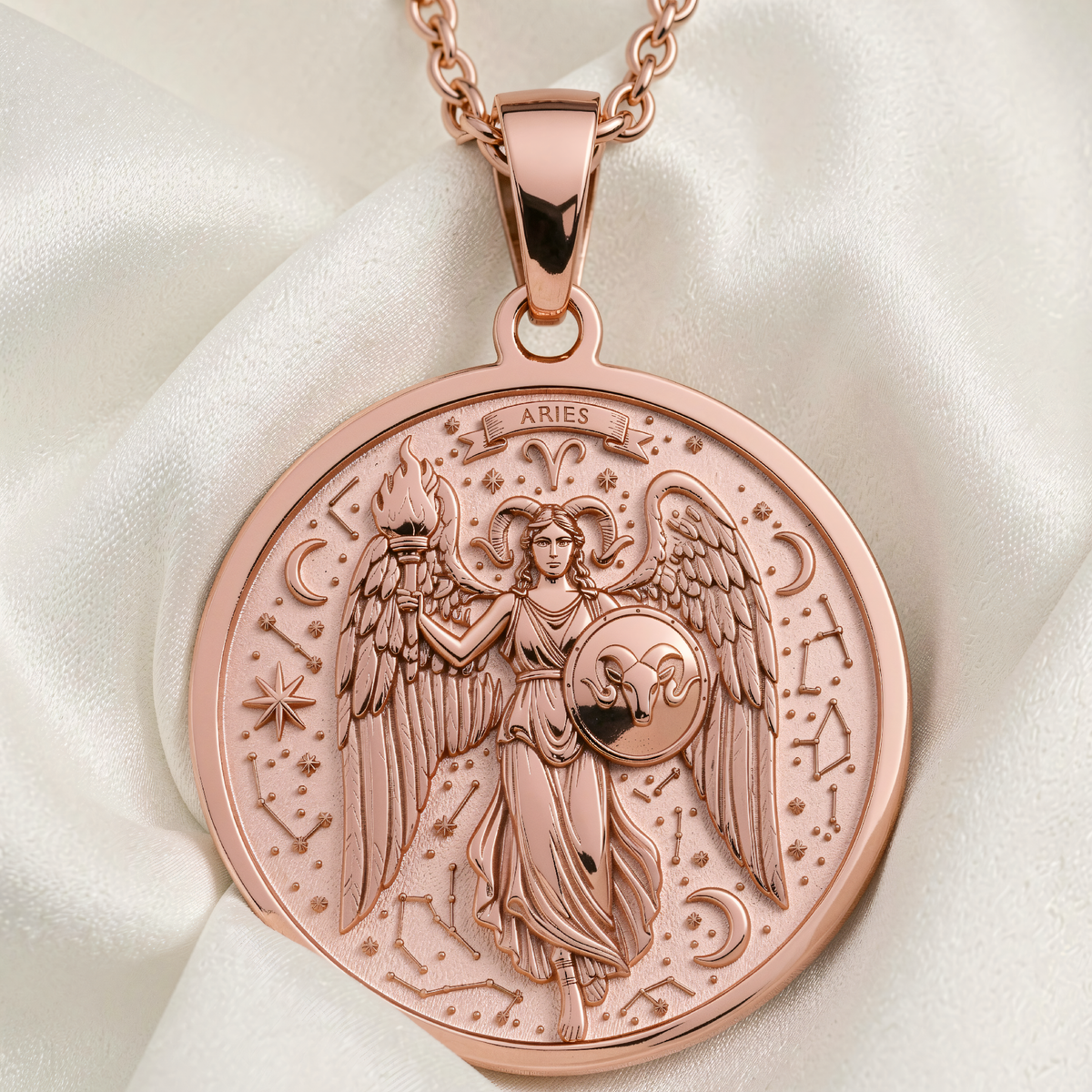 Aries Ram Zodiac Pendant in rose gold plated finish, front view of round medallion with engraved angel holding torch and shield amid constellations.
