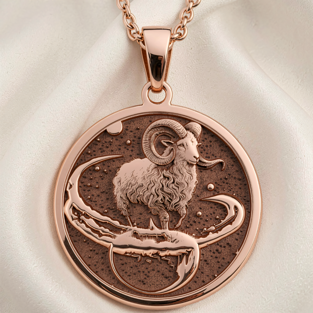 Aries Zodiac Necklace pendant in 14K rose gold plated showing front view of engraved ram on crescent moon with stars.