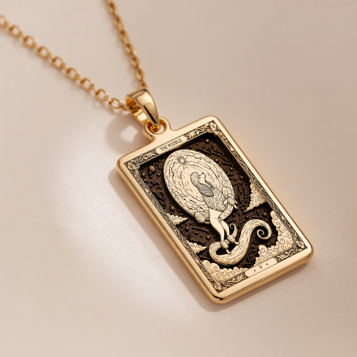 An heirloom-quality 14K solid gold Poodle tarot pendant. The art nouveau design symbolizes elegance, a precious dog mom gift.